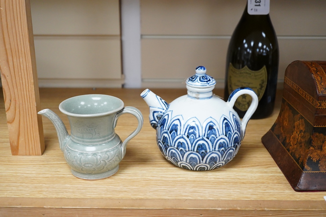 A Chinese blue and white teapot and cover, Xuande mark but later and a Chinese celadon glazed jug, tallest 13.5cm